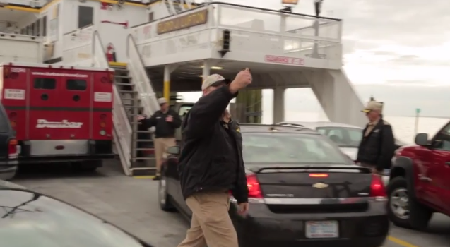 ferry worker loading cars