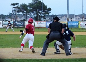 That's a base hit for the man in red--an Outer Banks Daredevil. Photo, Kip Tabb