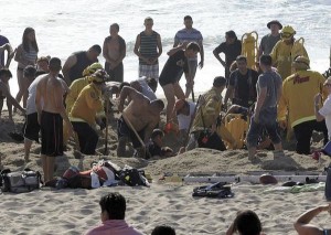 Half Moon Bay California emergency crew workers and volunteers working to rescue a man at Francis State Beach. AP Photo/Half Moon Bay Review, Dean Coppola