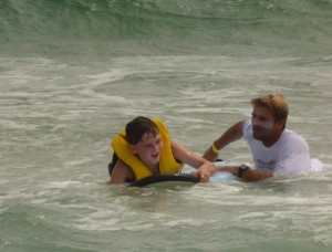 In the water and learning to surf.