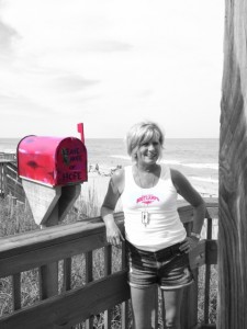 Sue Goodrich and her Red Mailbox of Hope. Photo, Coast Magazine.