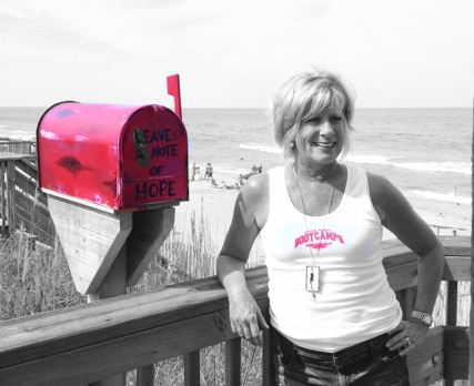 Sue Goodrich and her Red Mailbox of Hope. Photo, Coast Magazine.