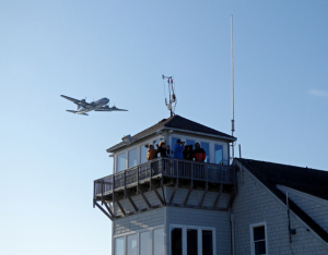 The Candy Bomber flying over the Dare County Airport control tower. Photo, Kip Tabb
