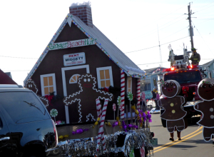 Winner of Most Creative float, Midgett Realty's Gingerbread House.