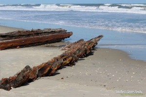 exposed shipwreck on the beach