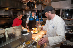 Hard at work in the kitchen. Photo, Outer Banks Voice.