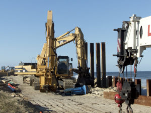 Heavy equipment goes to work to repair the Beach Road in Kitty Hawk after Hurricane Matthew. Photo, Kip Tabb