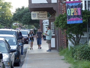 Downtown Manteo in the summer showing the Pioneer Theater, the oldest family owned theater in the nation. Photo Kip Tabb