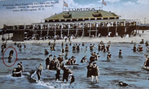 100 years of surfing in North Carolina. 1917 postcard suggests an early surfer at Wrightsville Beach in red circle. Image NC Maritime History Museum.