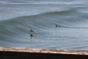 A Mickey McCarthy picture. Surfers at Avalon Pier, Kill Devil Hills, NC.