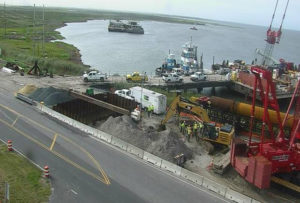 Working on fixing the severed power cable at the Bonner Bridge in late July, 2017.