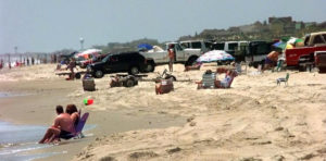 Summer sunbathers on Carova Beach by entrance to the 4WD area. Photo, Virginia Pilot