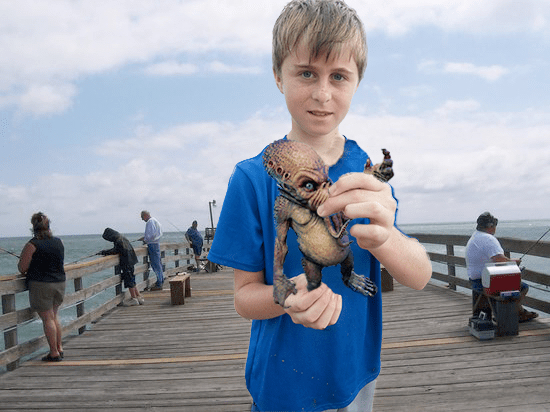 Stevie Williams from Toledo, Ohio holds the baby Cthulhu he just landed, OBX Report