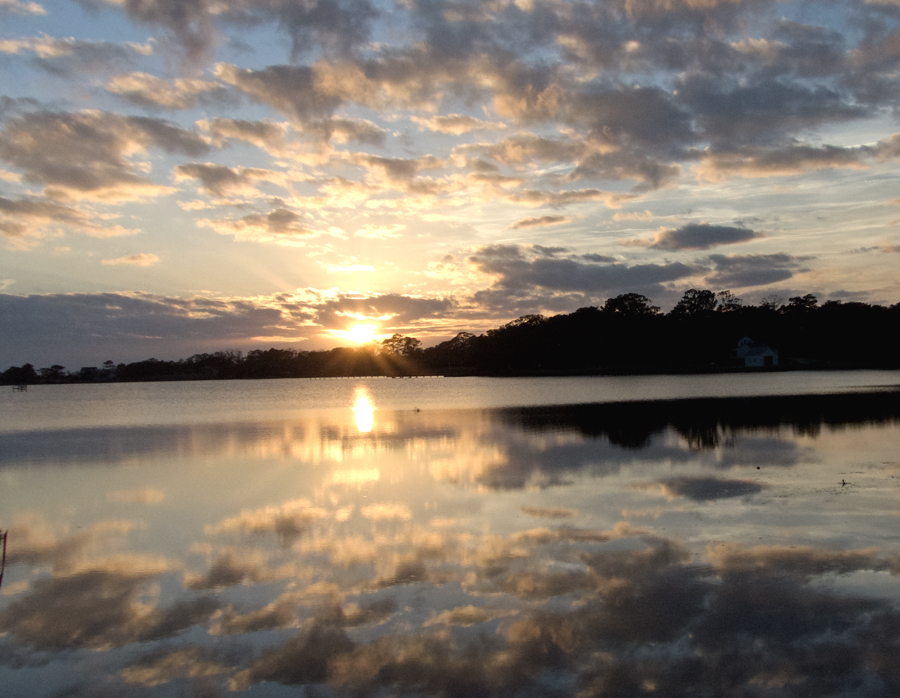 Sunset on Kitty Hawk Bay. Kitty Hawk is on the the Outer Banks towns who traces its name to Native American roots.