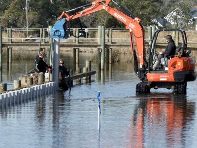 Installing the sills that will create a living shoreline.