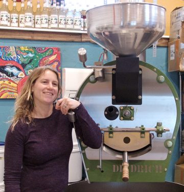 Ashley Linnekin and the roaster used to create the coffee for Ashley’s Espresso Parlour. (Kip Tabb)