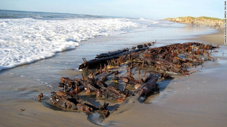 The unidentified remains of a wooden ship that sank off Hatteras Island was uncovered by recent storms.