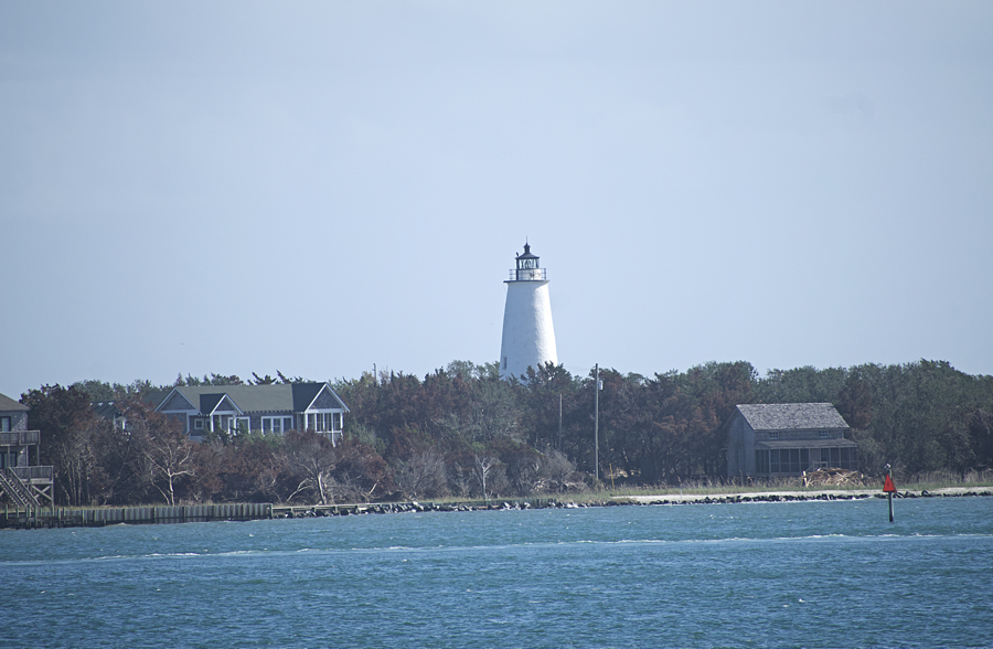 The Ocracoke Lighthouse stands guard over a mostly deserted Silver Lake as the Village of Ocracoke recovers.