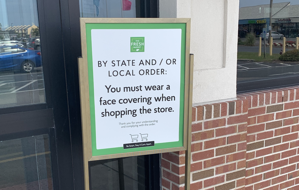 Signs like this one outside the Fresh Market in Nags Head will become commonplace next week.